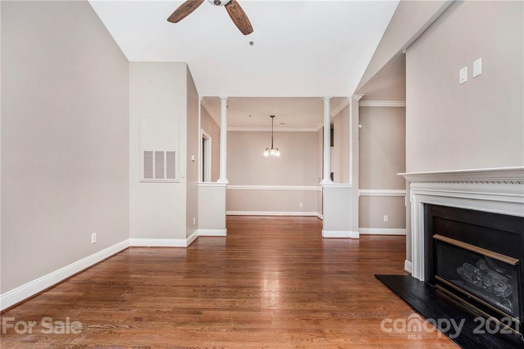 5730 Closeburn Road, Unit N Charlotte, NC 28210 - Photo 12 of 21 a view of empty room with wooden floor and fireplace