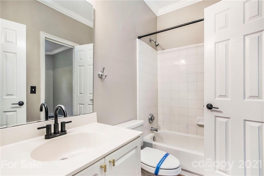 5730 Closeburn Road, Unit N Charlotte, NC 28210 - Photo 16 of 21 a bathroom with a sink toilet and shower