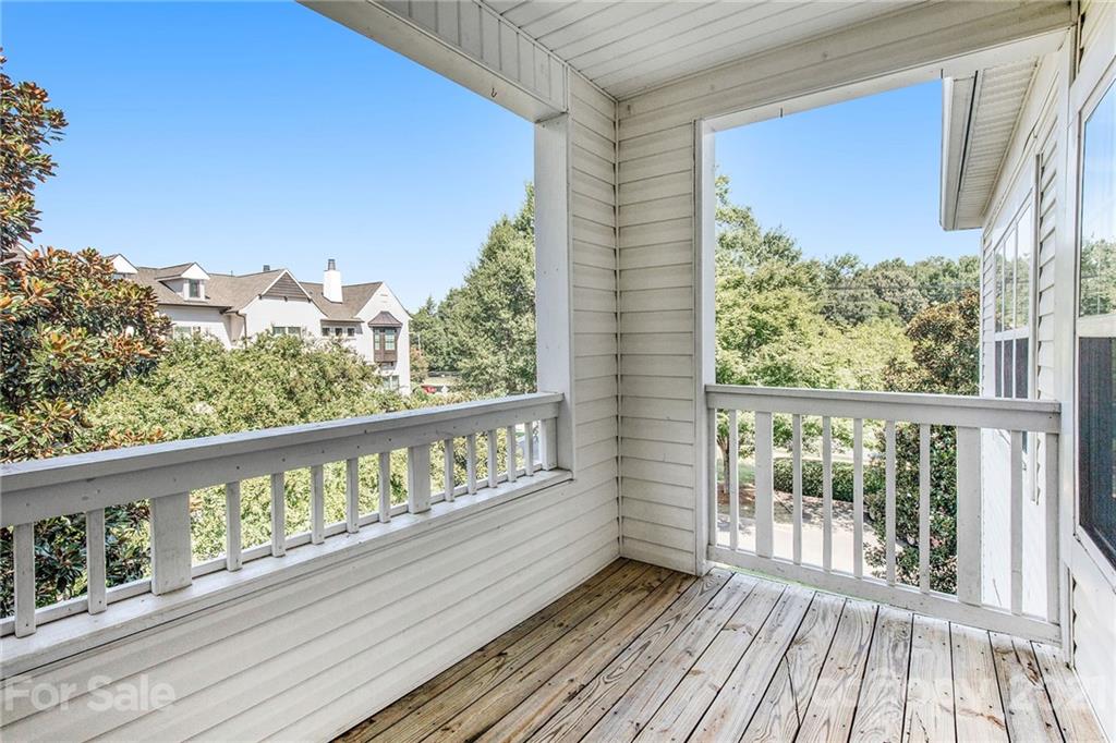 5730 Closeburn Road, Unit N Charlotte, NC 28210 - Photo 19 of 21 a view of a balcony with wooden floor