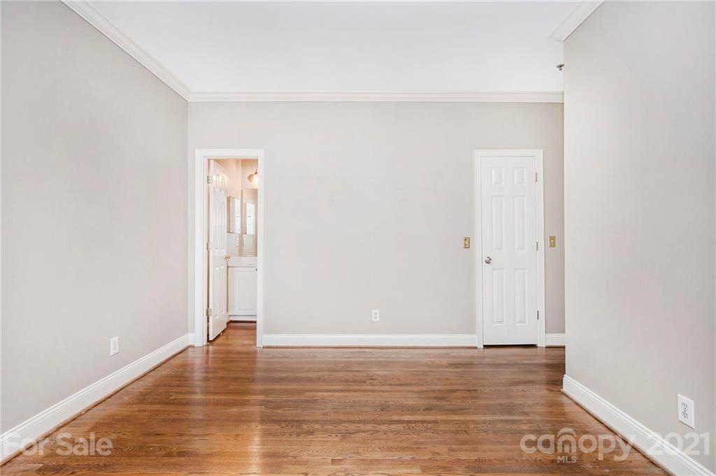 5730 Closeburn Road, Unit N Charlotte, NC 28210 - Photo 21 of 21 a view of an empty room with wooden floor