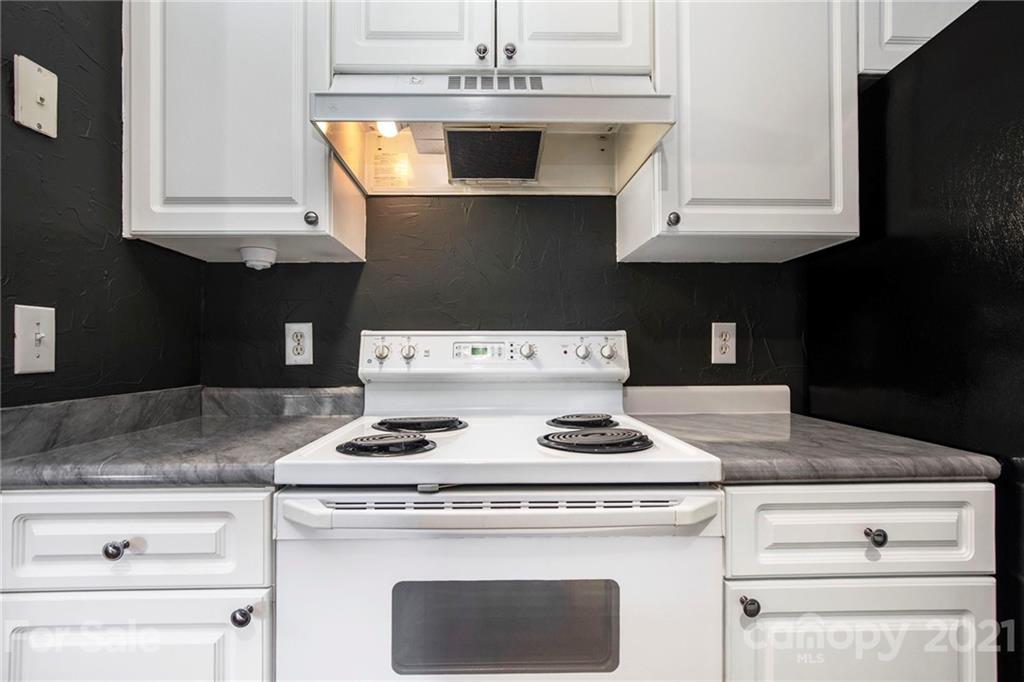 5730 Closeburn Road, Unit N Charlotte, NC 28210 - Photo 5 of 21 a stove top oven sitting inside of a kitchen