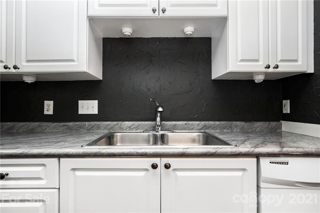 5730 Closeburn Road, Unit N Charlotte, NC 28210 - Photo 6 of 21 a kitchen with granite countertop a sink and a granite counter tops