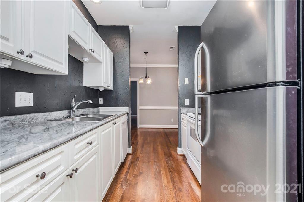 5730 Closeburn Road, Unit N Charlotte, NC 28210 - Photo 7 of 21 a kitchen with a refrigerator a sink and dishwasher