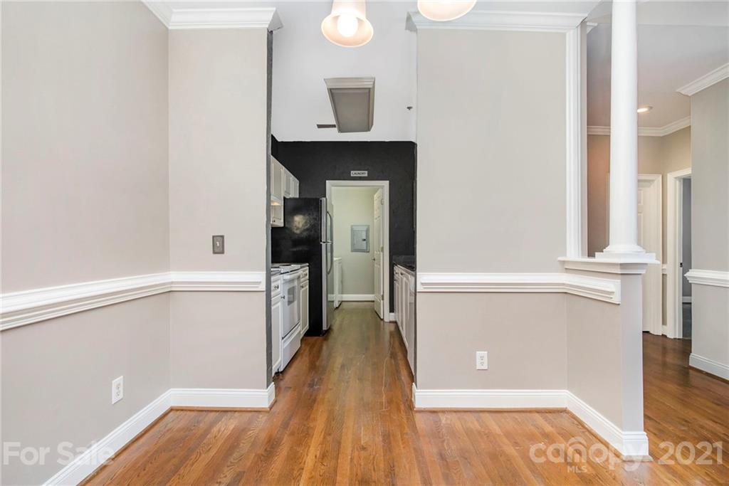 5730 Closeburn Road, Unit N Charlotte, NC 28210 - Photo 8 of 21 a view of a hallway with wooden floor and staircase