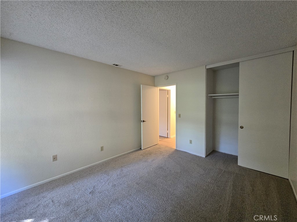 600 Central Avenue, Unit 386 Riverside, CA 92507 - Photo 12 of 21 an empty room with closet area