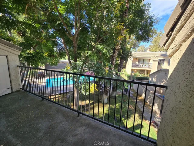 a view of a balcony with a pot