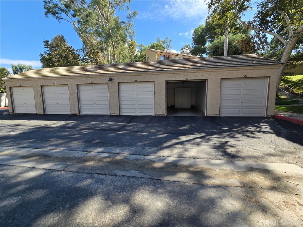 600 Central Avenue, Unit 386 Riverside, CA 92507 - Photo 20 of 21 a front view of a house with a garage