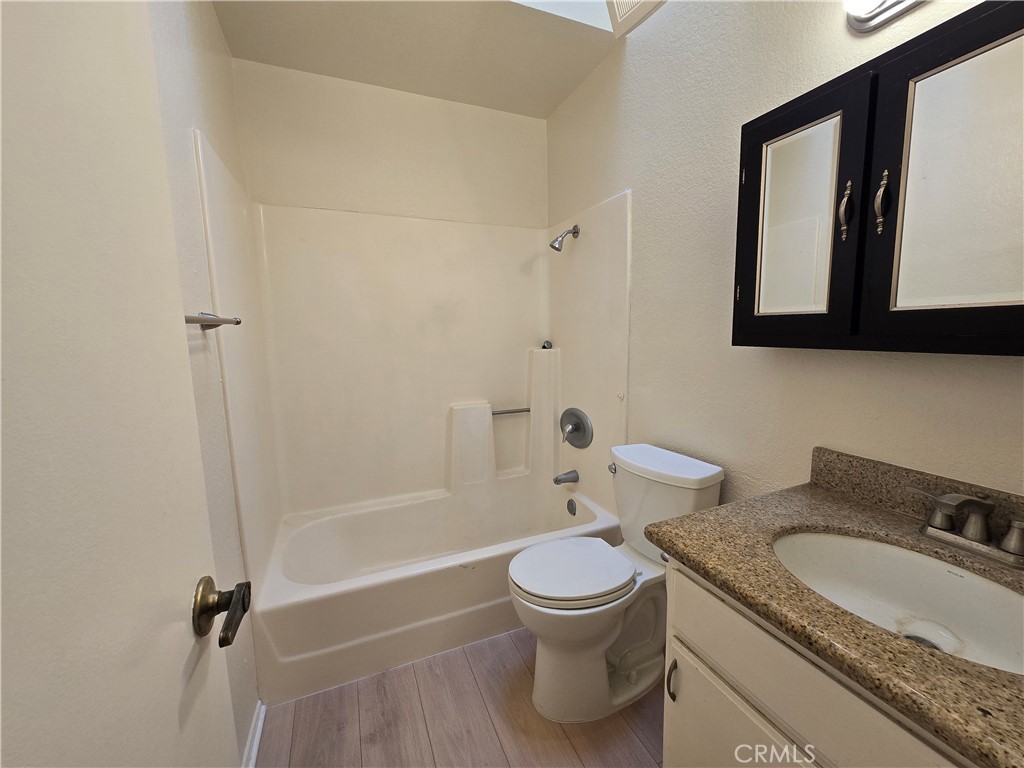 600 Central Avenue, Unit 386 Riverside, CA 92507 - Photo 9 of 21 a white toilet sitting next to a bathroom sink