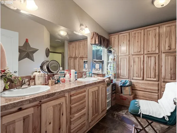 a bathroom with 2 sink tub and a mirror