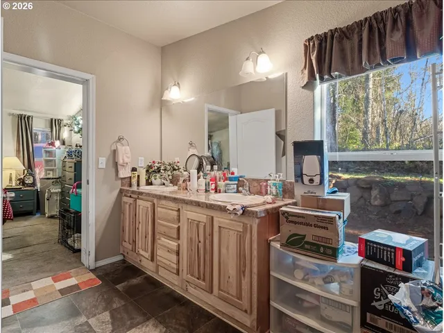 a kitchen with stainless steel appliances a stove and a sink