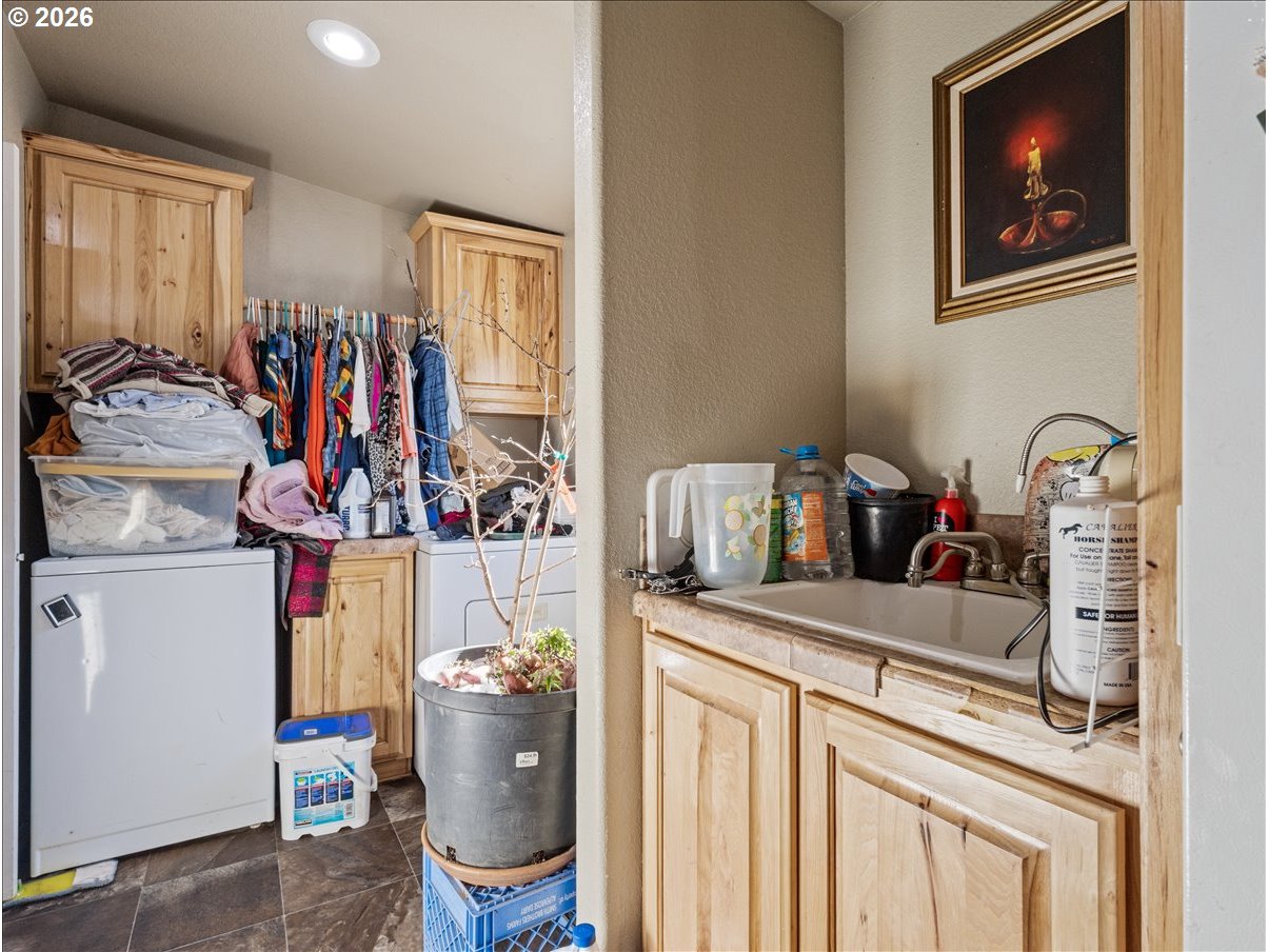 23728 Northeast Dole Valley Road Yacolt, WA 98675 - Photo 23 of 46 a view of a kitchen with fridge and workspace