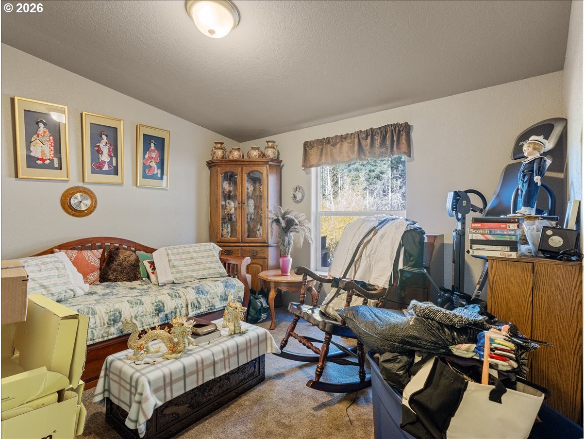 23728 Northeast Dole Valley Road Yacolt, WA 98675 - Photo 24 of 46 a living room with furniture and a flat screen tv