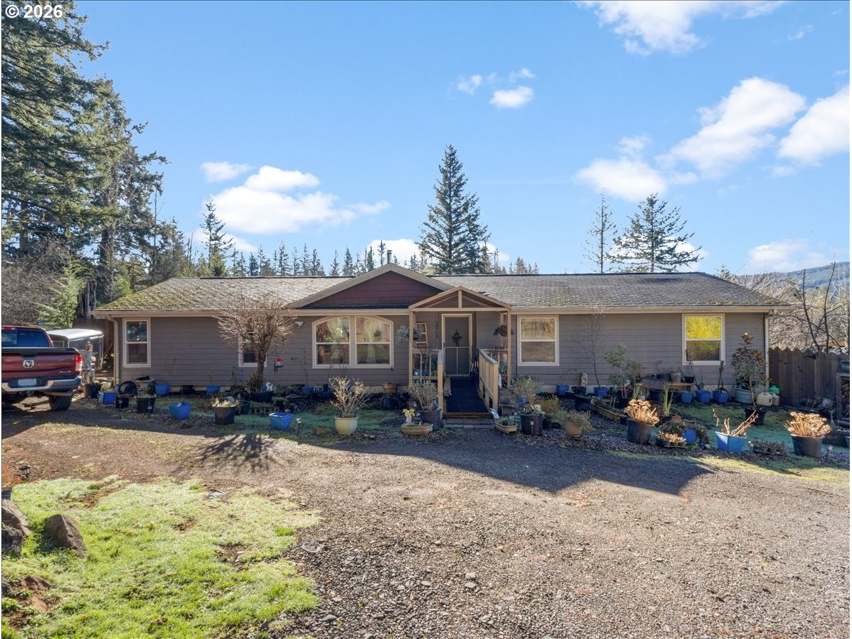 23728 Northeast Dole Valley Road Yacolt, WA 98675 - Photo 25 of 46 a view of a house with a yard and sitting area