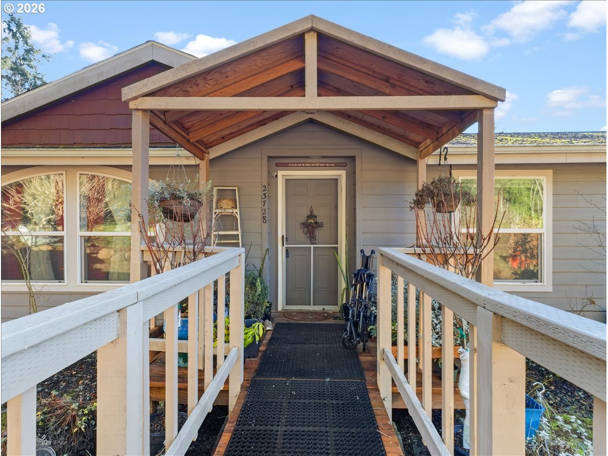 23728 Northeast Dole Valley Road Yacolt, WA 98675 - Photo 3 of 46 a view of a house with wooden fence