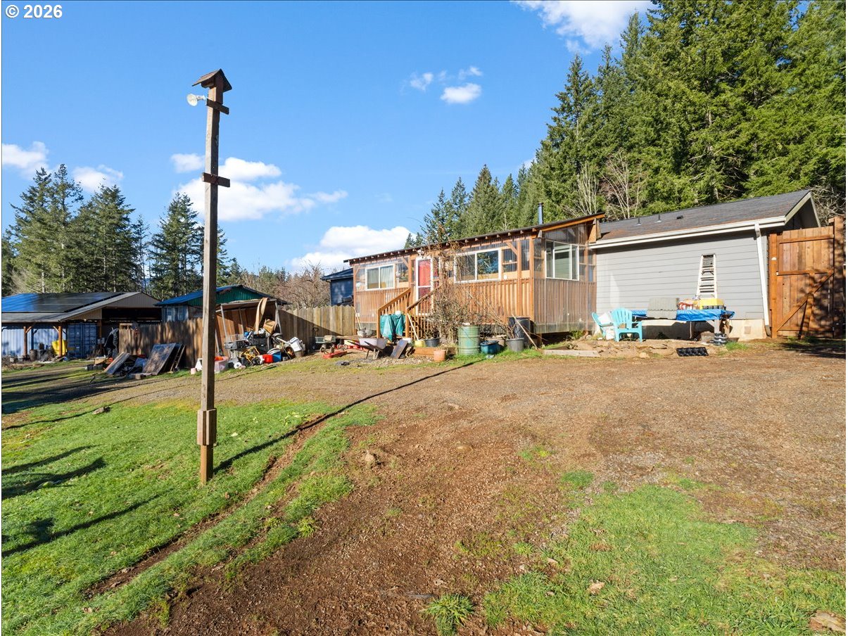 23728 Northeast Dole Valley Road Yacolt, WA 98675 - Photo 33 of 46 a street view with tall buildings and a yard