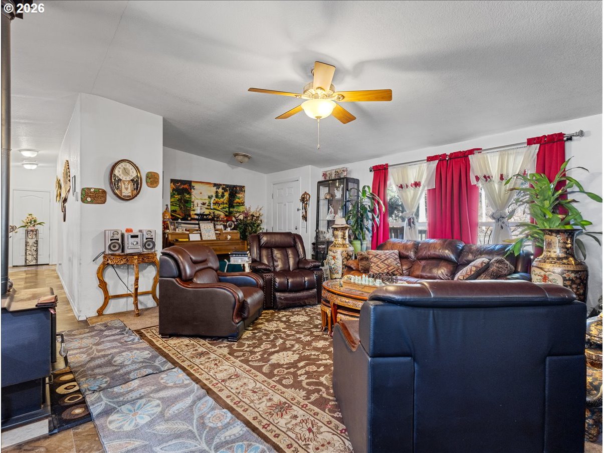 23728 Northeast Dole Valley Road Yacolt, WA 98675 - Photo 4 of 46 a living room with furniture kitchen and a chandelier