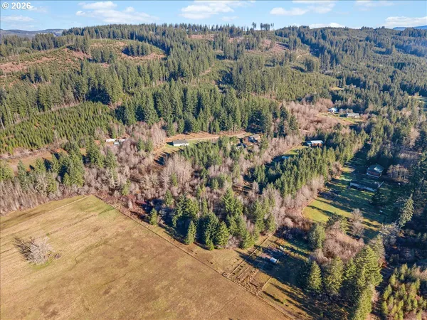 an aerial view of a house with outdoor space