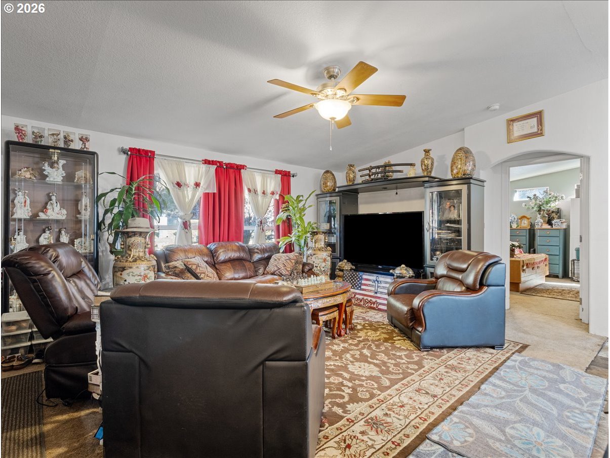 23728 Northeast Dole Valley Road Yacolt, WA 98675 - Photo 7 of 46 a living room with furniture and a flat screen tv
