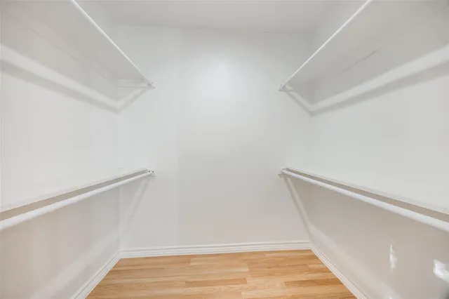 a view of room with wooden floor