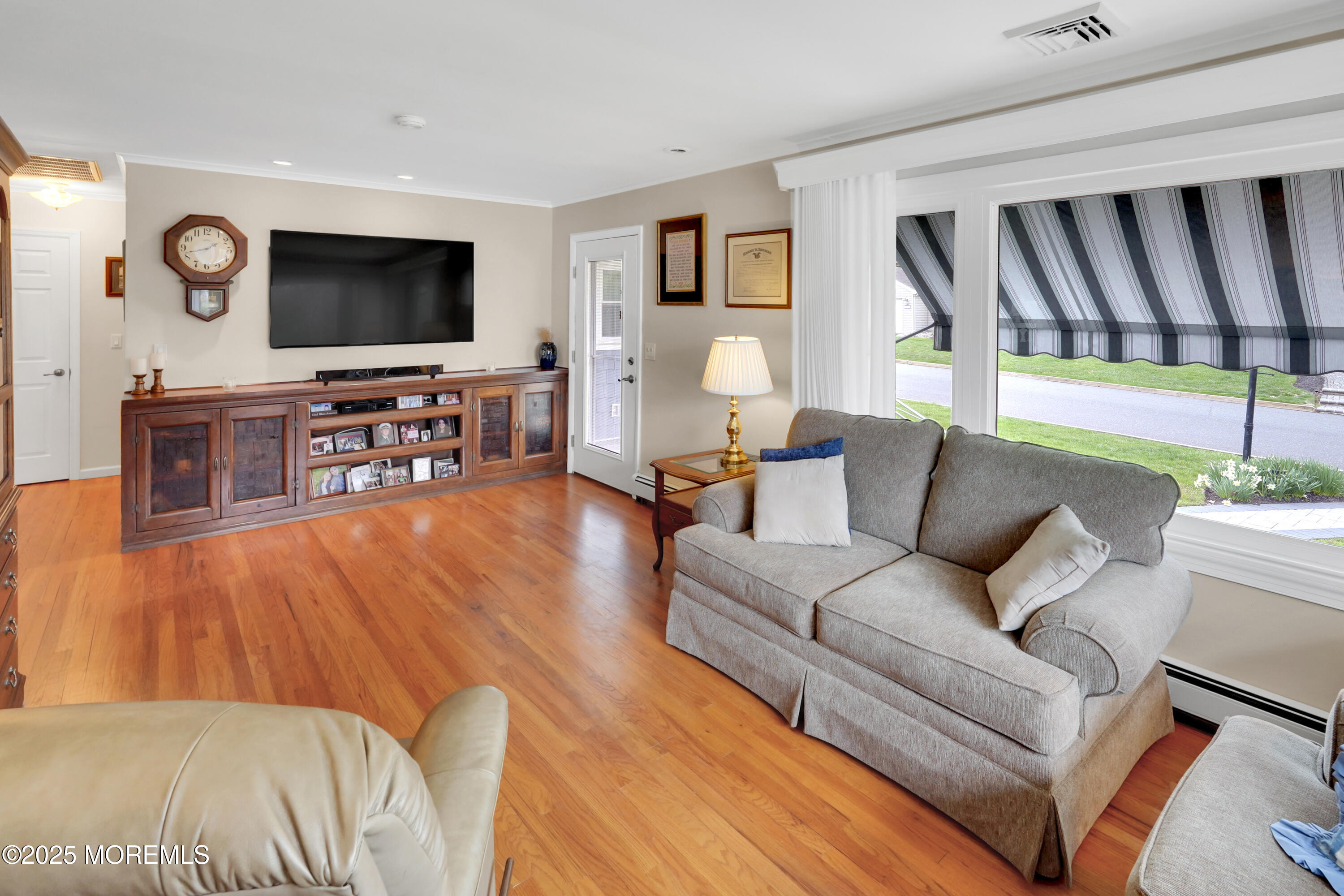 1635 Marconi Road Wall, NJ 07719 - Photo 12 of 39 a living room with furniture and a flat screen tv