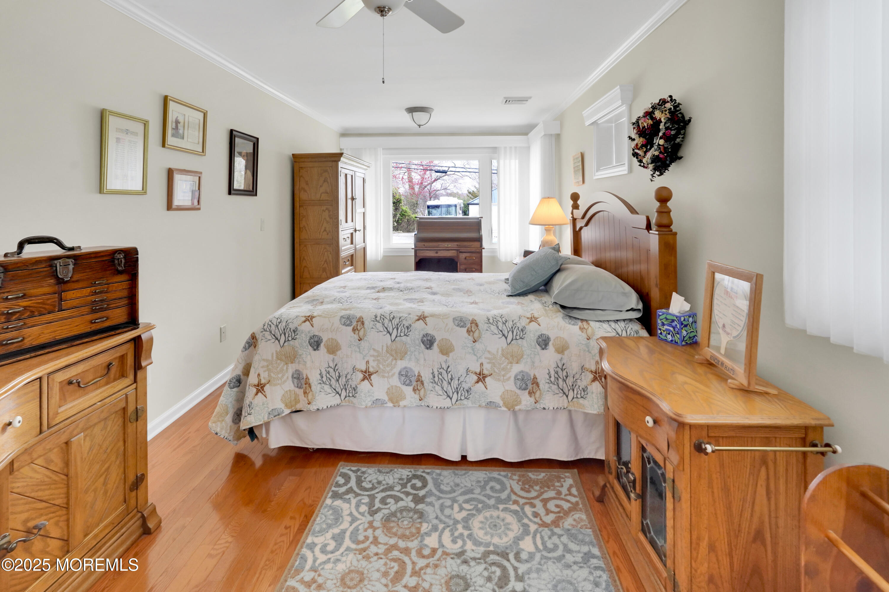 1635 Marconi Road Wall, NJ 07719 - Photo 14 of 39 a bedroom with a bed and wooden floor