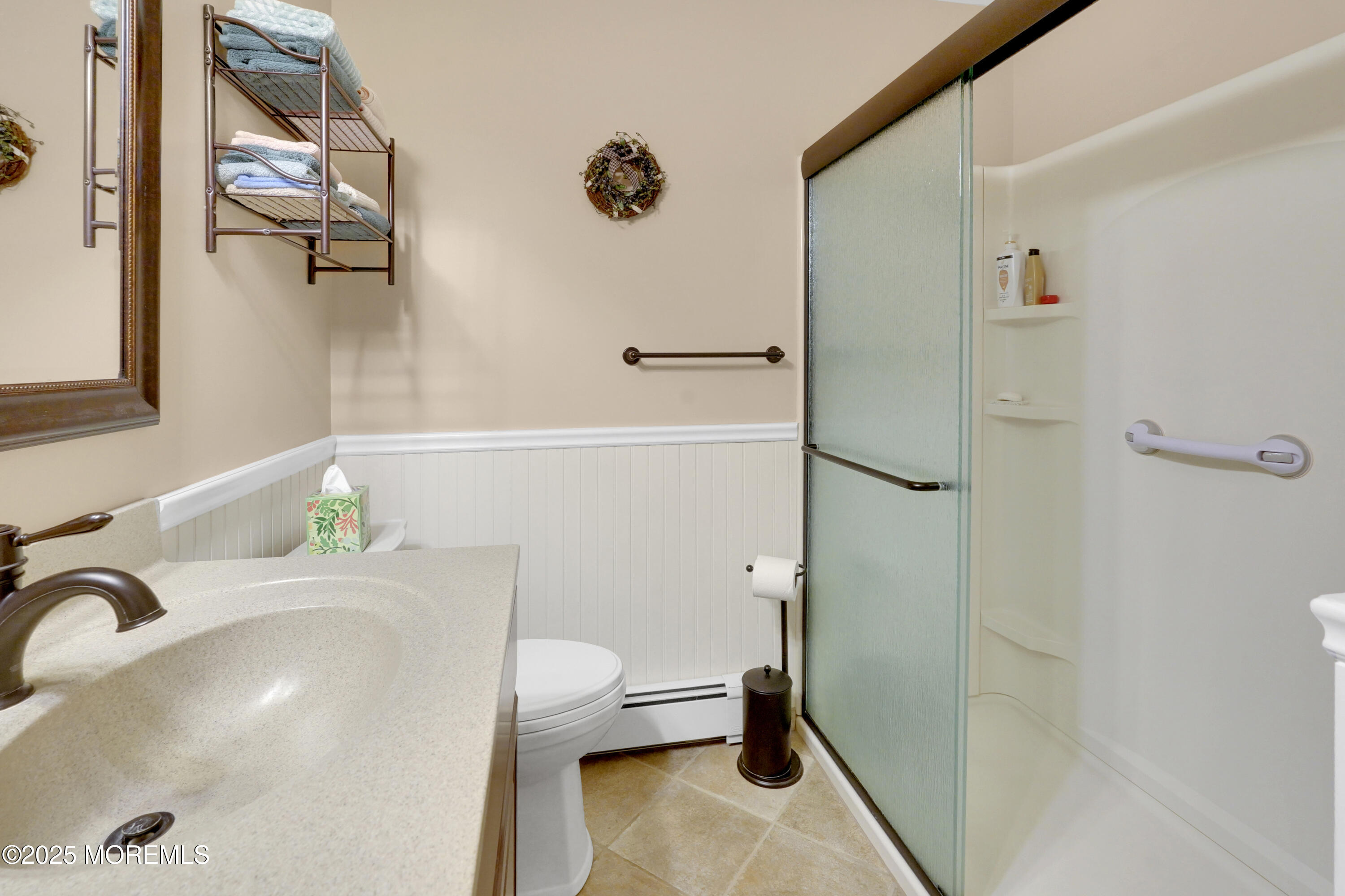 1635 Marconi Road Wall, NJ 07719 - Photo 20 of 39 a bathroom with a sink a toilet and a shower