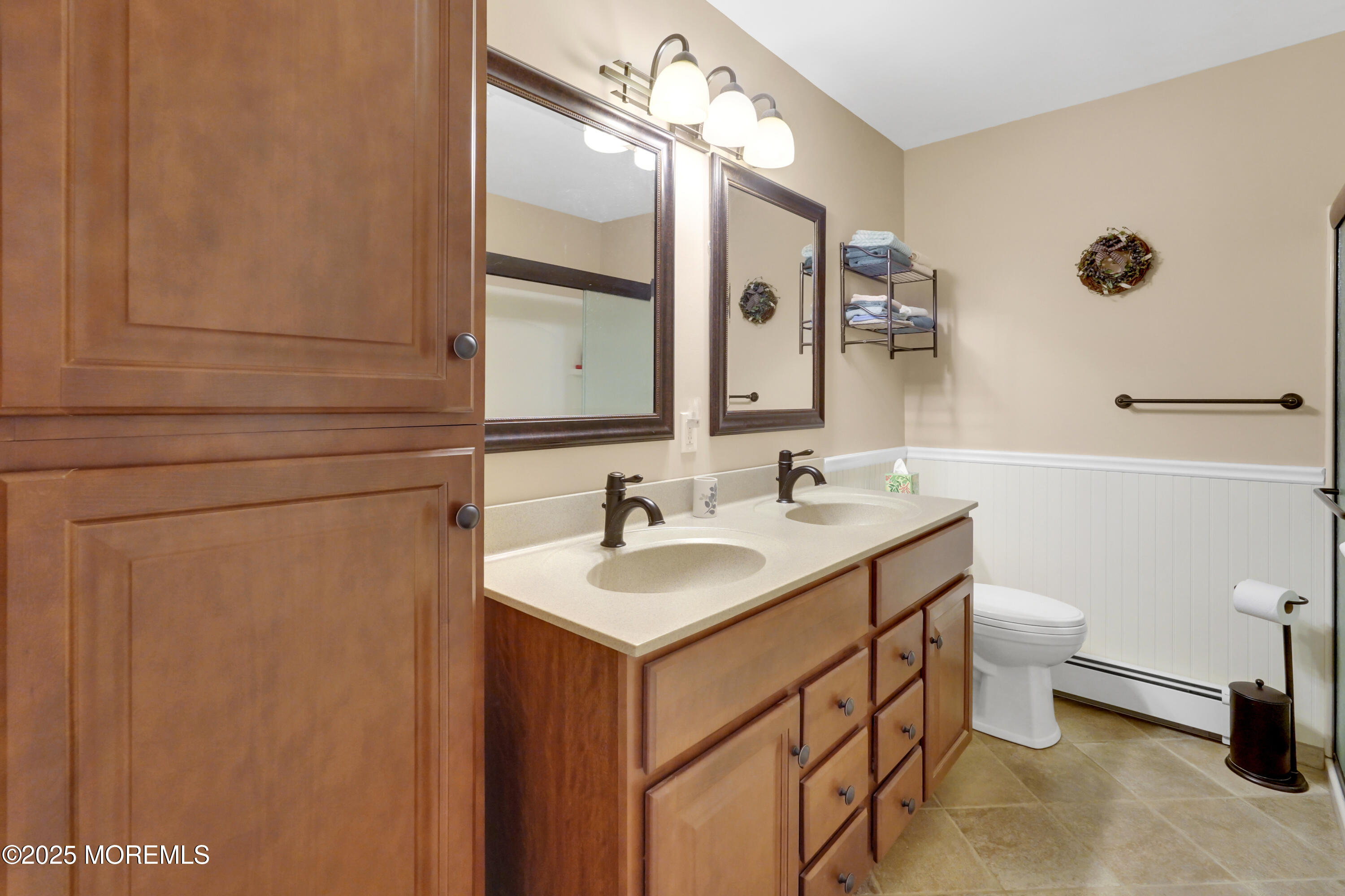 1635 Marconi Road Wall, NJ 07719 - Photo 21 of 39 a bathroom with a sink a toilet and mirror