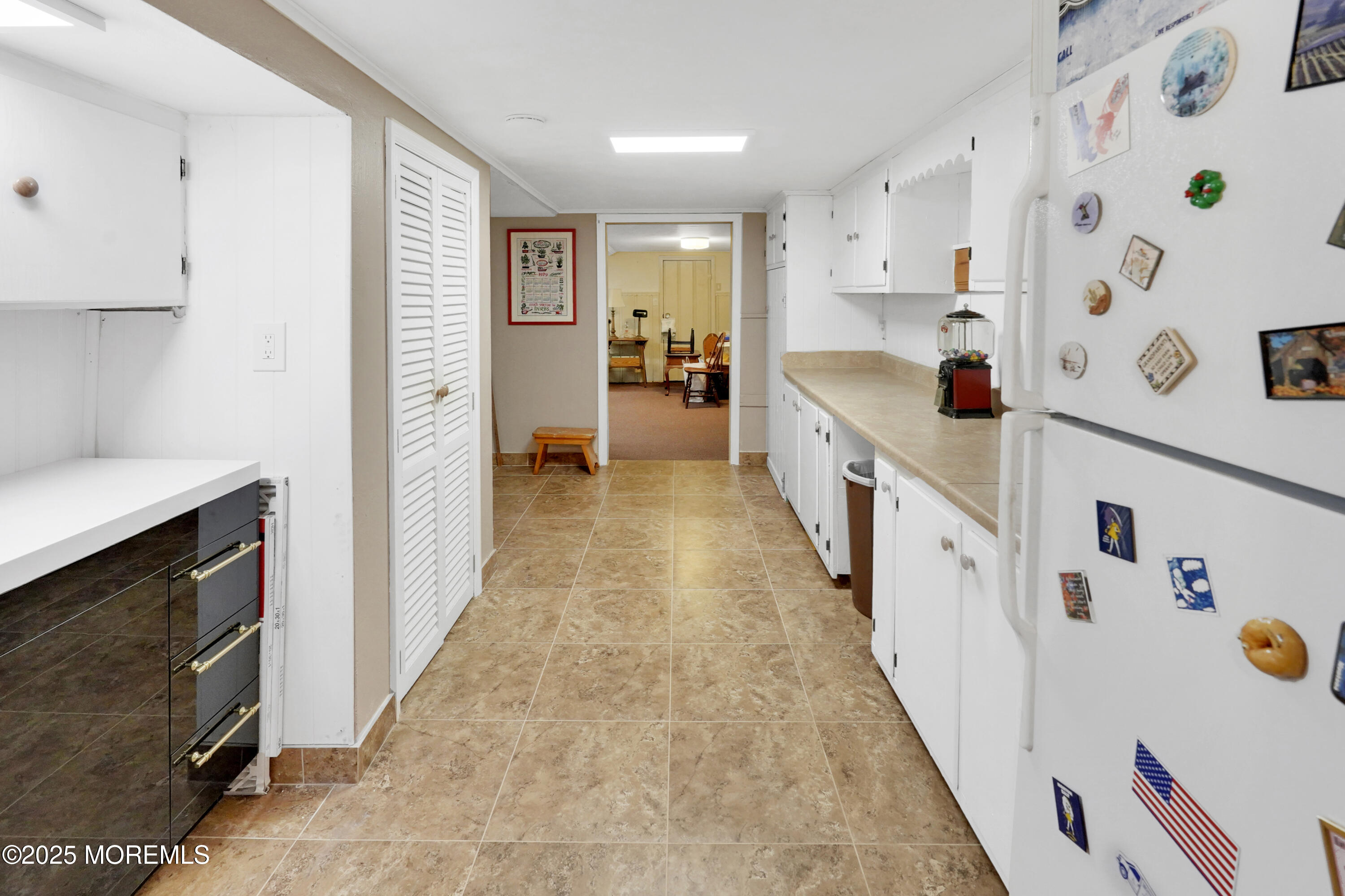 1635 Marconi Road Wall, NJ 07719 - Photo 25 of 39 a large white kitchen with lot of clutter on the wall
