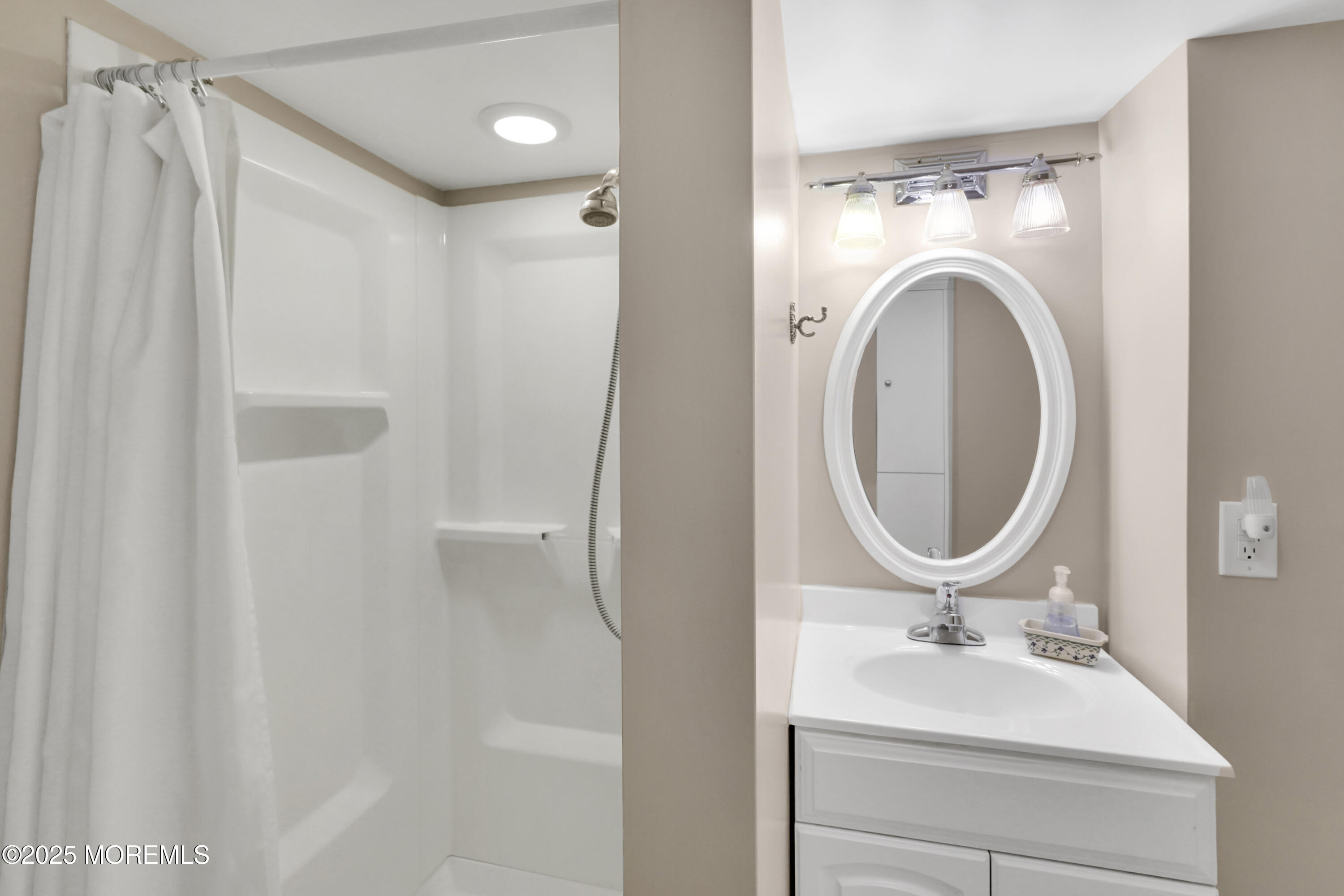 1635 Marconi Road Wall, NJ 07719 - Photo 27 of 39 a bathroom with a sink a toilet and a mirror