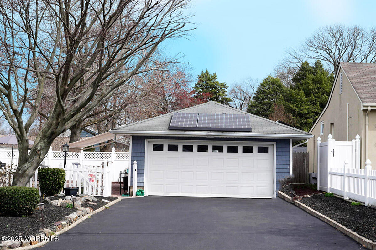 1635 Marconi Road Wall, NJ 07719 - Photo 3 of 39 a house that has a tree in front of it