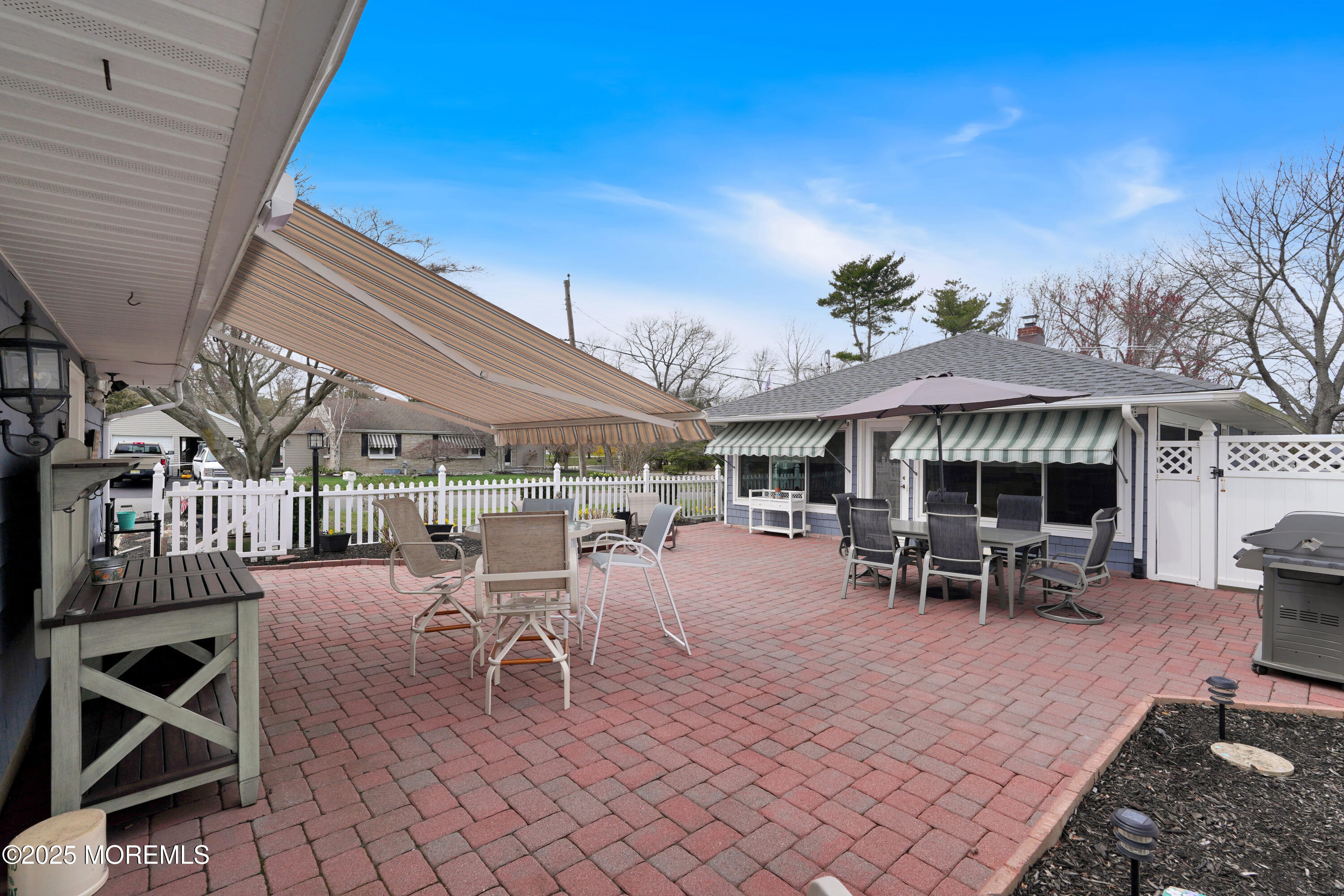 1635 Marconi Road Wall, NJ 07719 - Photo 34 of 39 a view of a patio with table and chairs a barbeque