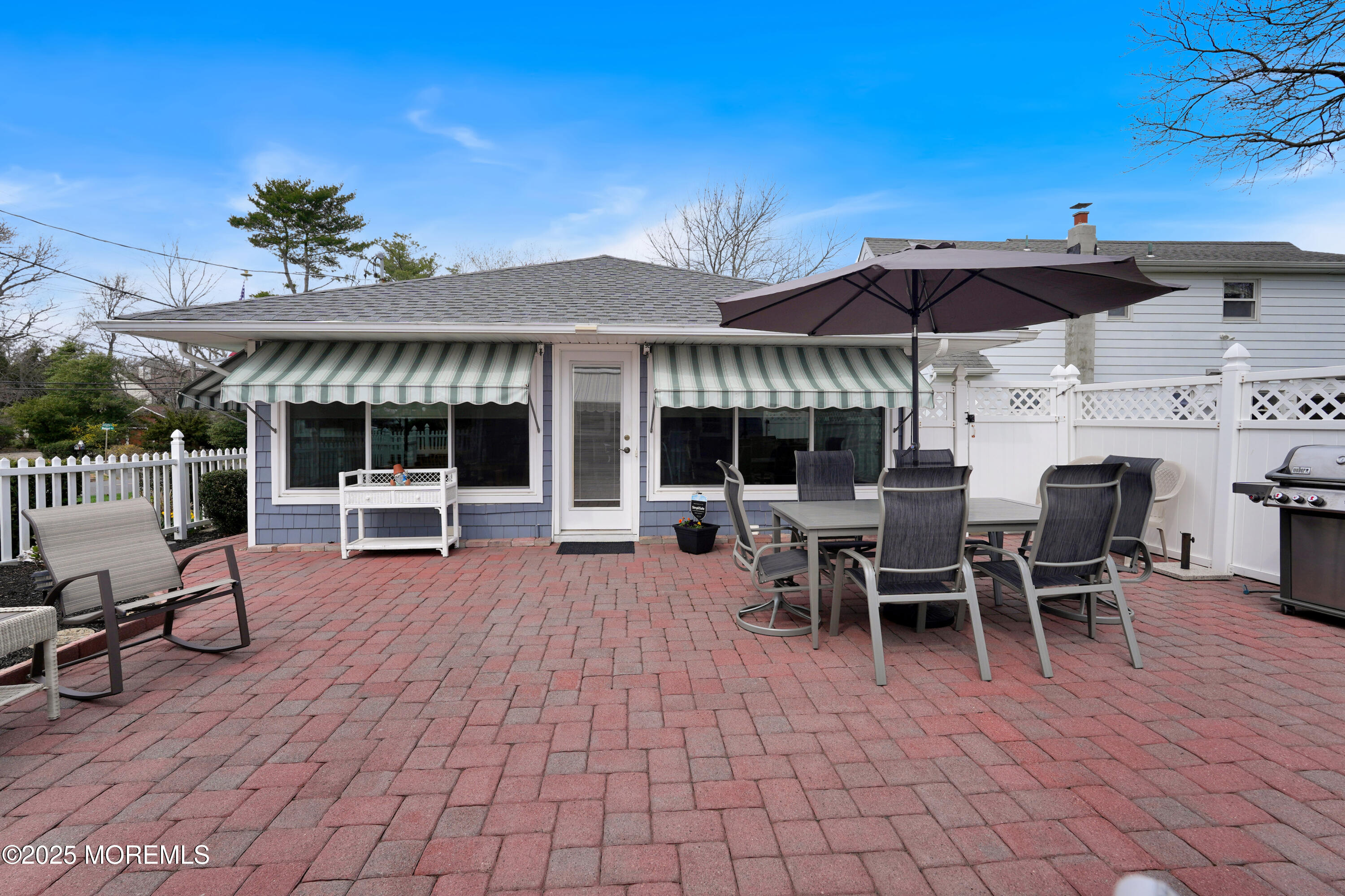 1635 Marconi Road Wall, NJ 07719 - Photo 35 of 39 a view of a patio with table and chairs under an umbrella