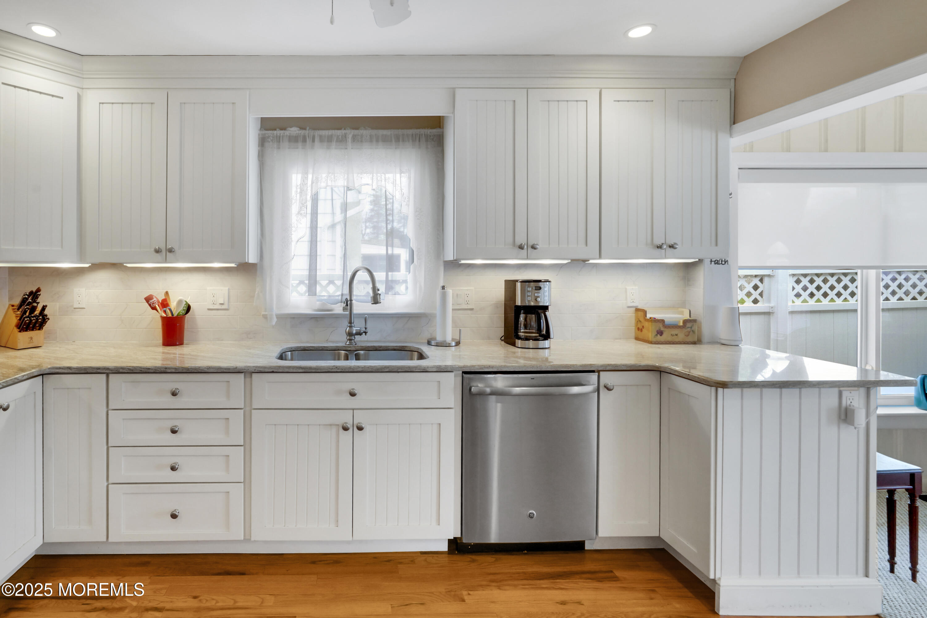 1635 Marconi Road Wall, NJ 07719 - Photo 5 of 39 a kitchen with white cabinets and sink