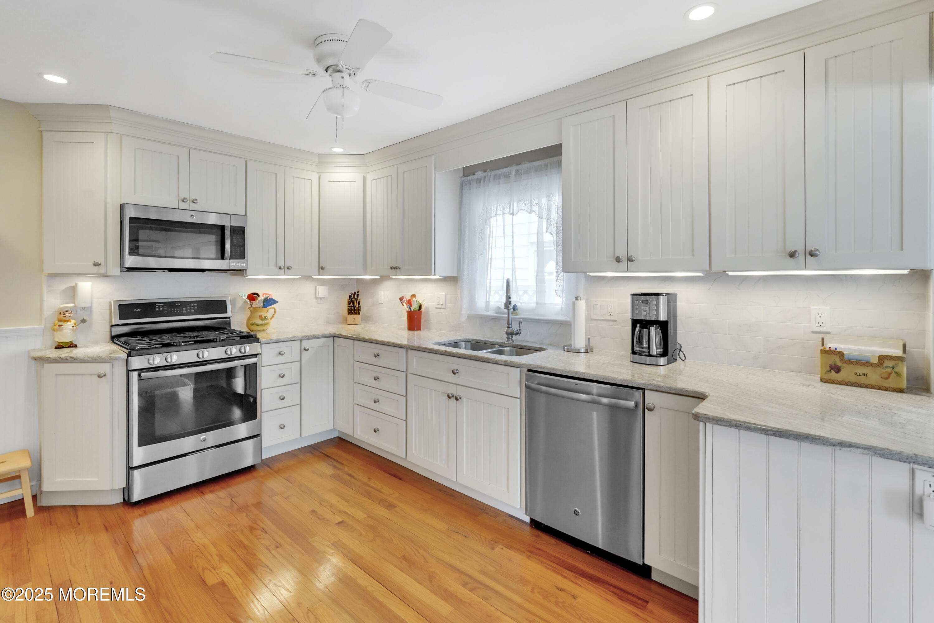 1635 Marconi Road Wall, NJ 07719 - Photo 6 of 39 a kitchen with granite countertop a stove top oven sink and cabinets