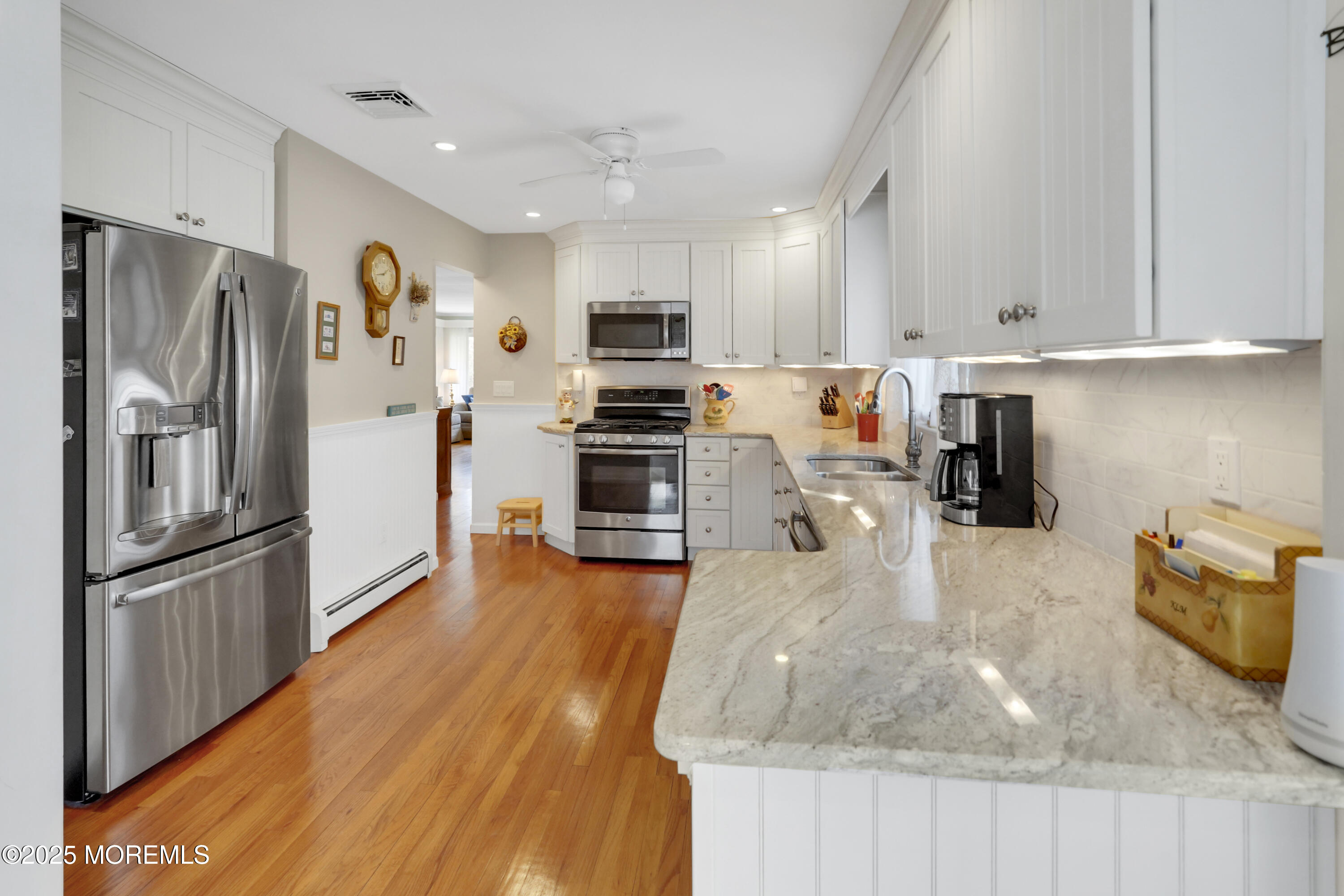 1635 Marconi Road Wall, NJ 07719 - Photo 8 of 39 a kitchen with stainless steel appliances granite countertop a refrigerator sink and stove