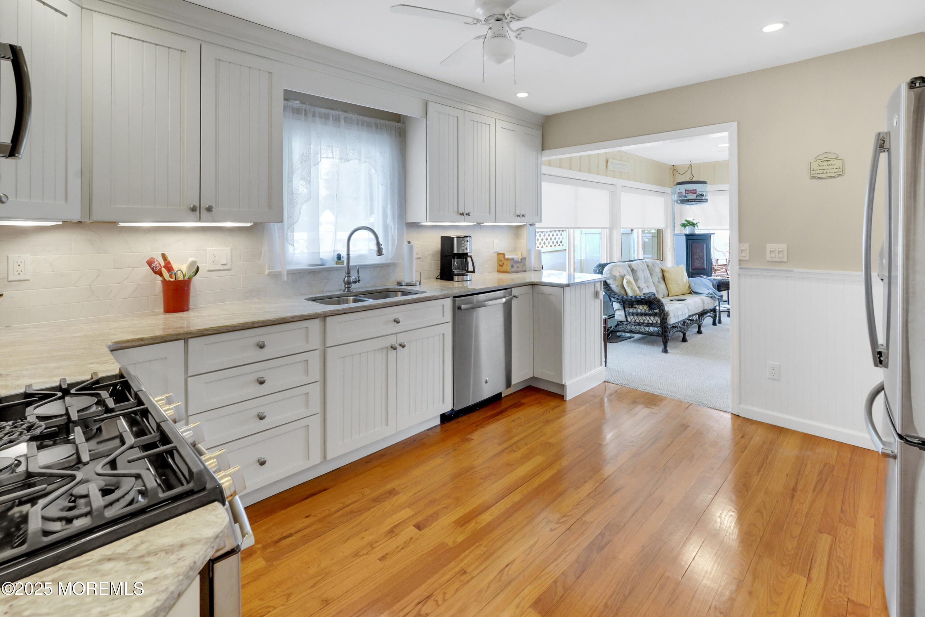 1635 Marconi Road Wall, NJ 07719 - Photo 9 of 39 a large kitchen with cabinets table and chairs