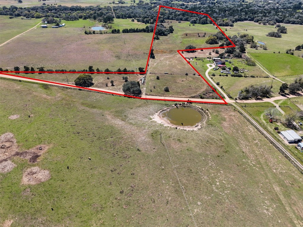 a view of swimming pool with a yard and seating space