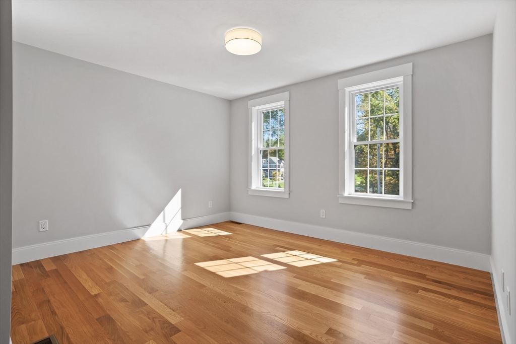 236 Bolton Road Harvard, MA 01451 - Photo 18 of 42 a view of empty room with wooden floor and fan