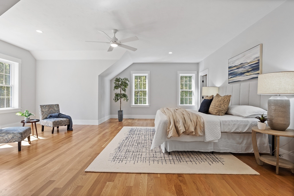 236 Bolton Road Harvard, MA 01451 - Photo 25 of 42 a bedroom with a bed and wooden floor
