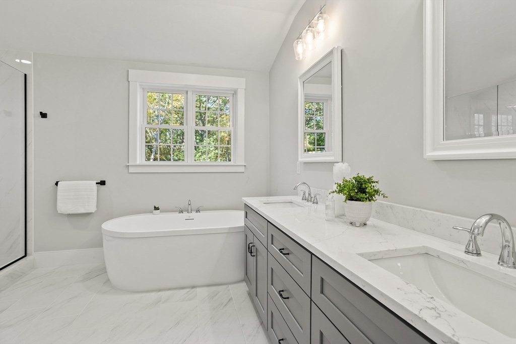 236 Bolton Road Harvard, MA 01451 - Photo 27 of 42 a bathroom with a granite countertop sink and a bathtub