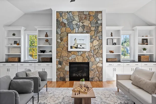 a living room with furniture and a fireplace