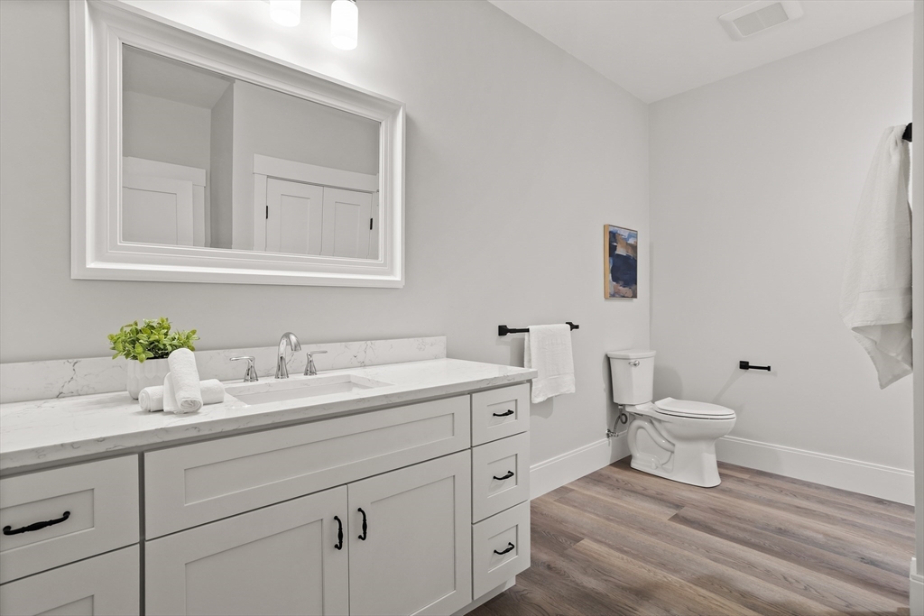 236 Bolton Road Harvard, MA 01451 - Photo 31 of 42 a bathroom with a toilet a sink and mirror