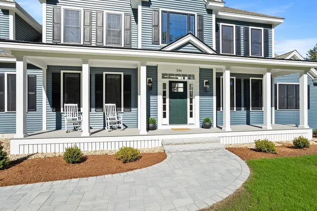 front view of a house with a yard