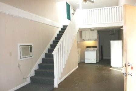831 North Spring Street Murfreesboro, TN 37130 - Photo 2 of 5 a view of staircase with white walls and a window