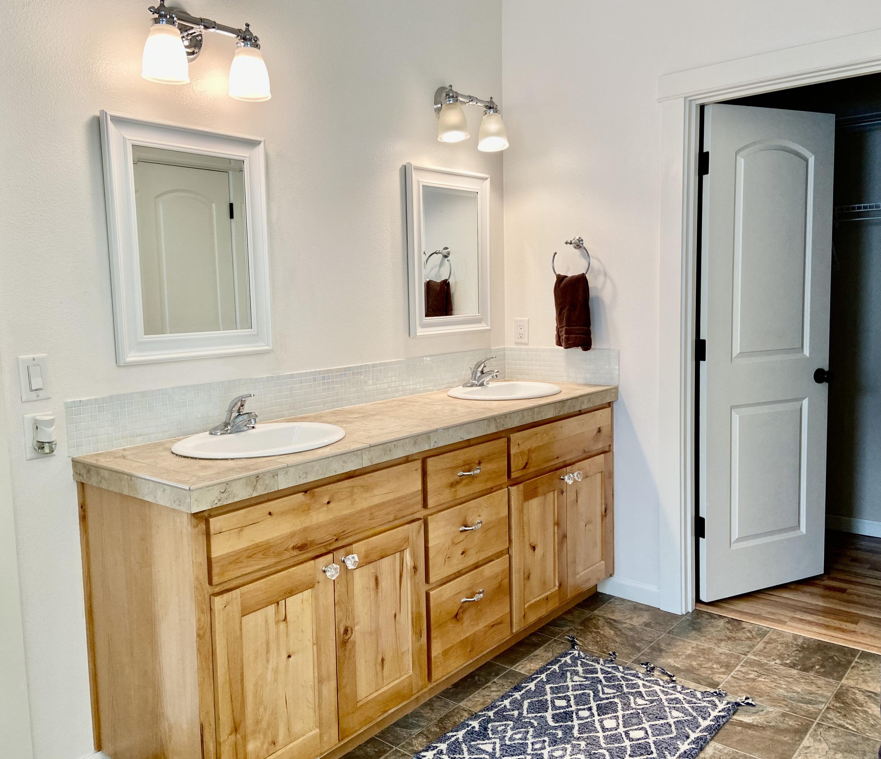 3191 Yellow Ribbon Drive Bend, OR 97701 - Photo 8 of 19 Primary bedroom?s bathroom and walk-in closet