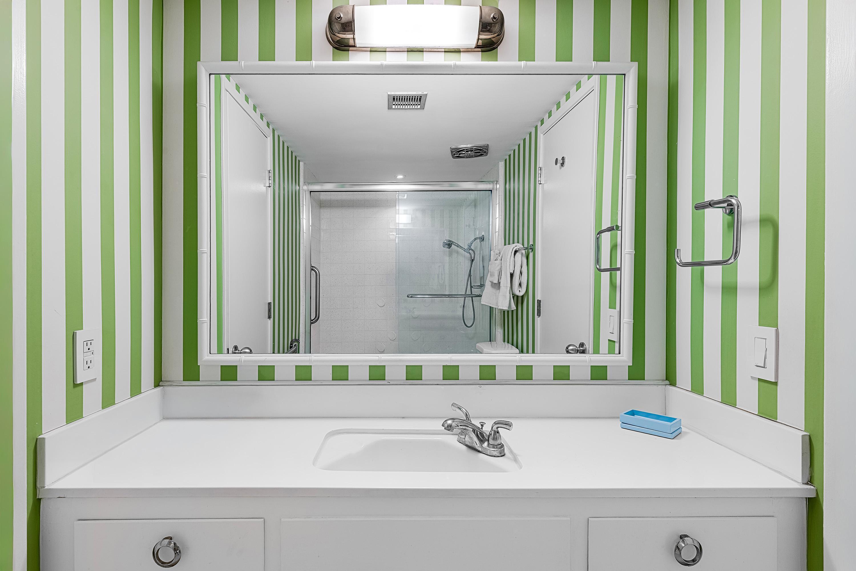 1855 Ramon Road, Unit 14 Palm Springs, CA 92264 - Photo 26 of 34 a bathroom with a sink and a mirror