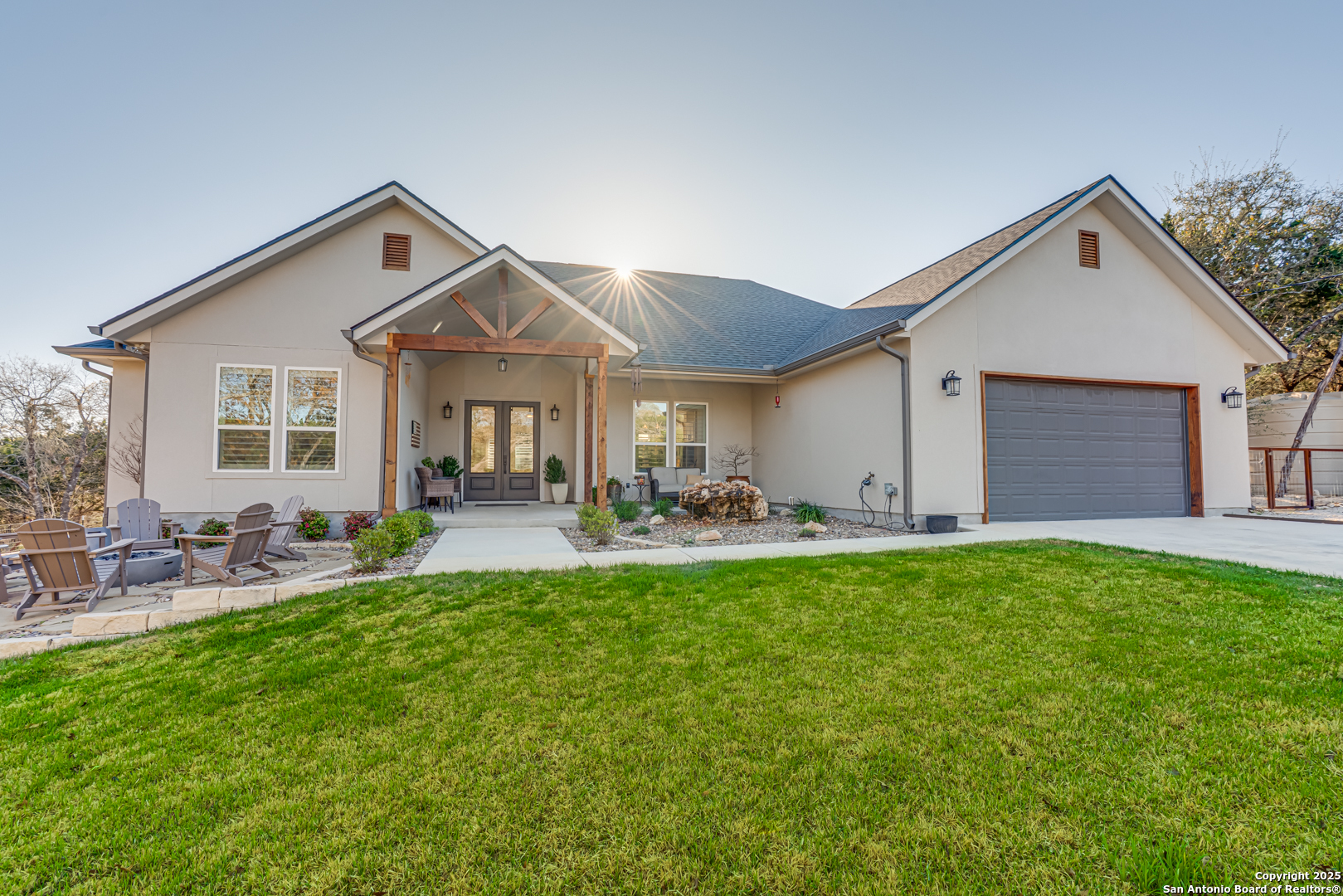 303 Saddle Mountain Drive Boerne, TX 78006 - Photo 1 of 1 a front view of house with yard and outdoor seating
