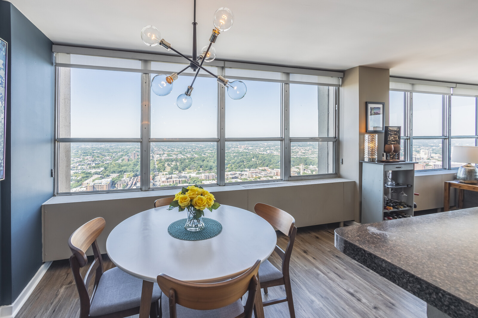 655 West Irving Park Road, Unit 4616 Chicago, IL 60613 - Photo 11 of 25 a view of a dining room with furniture window and outside view