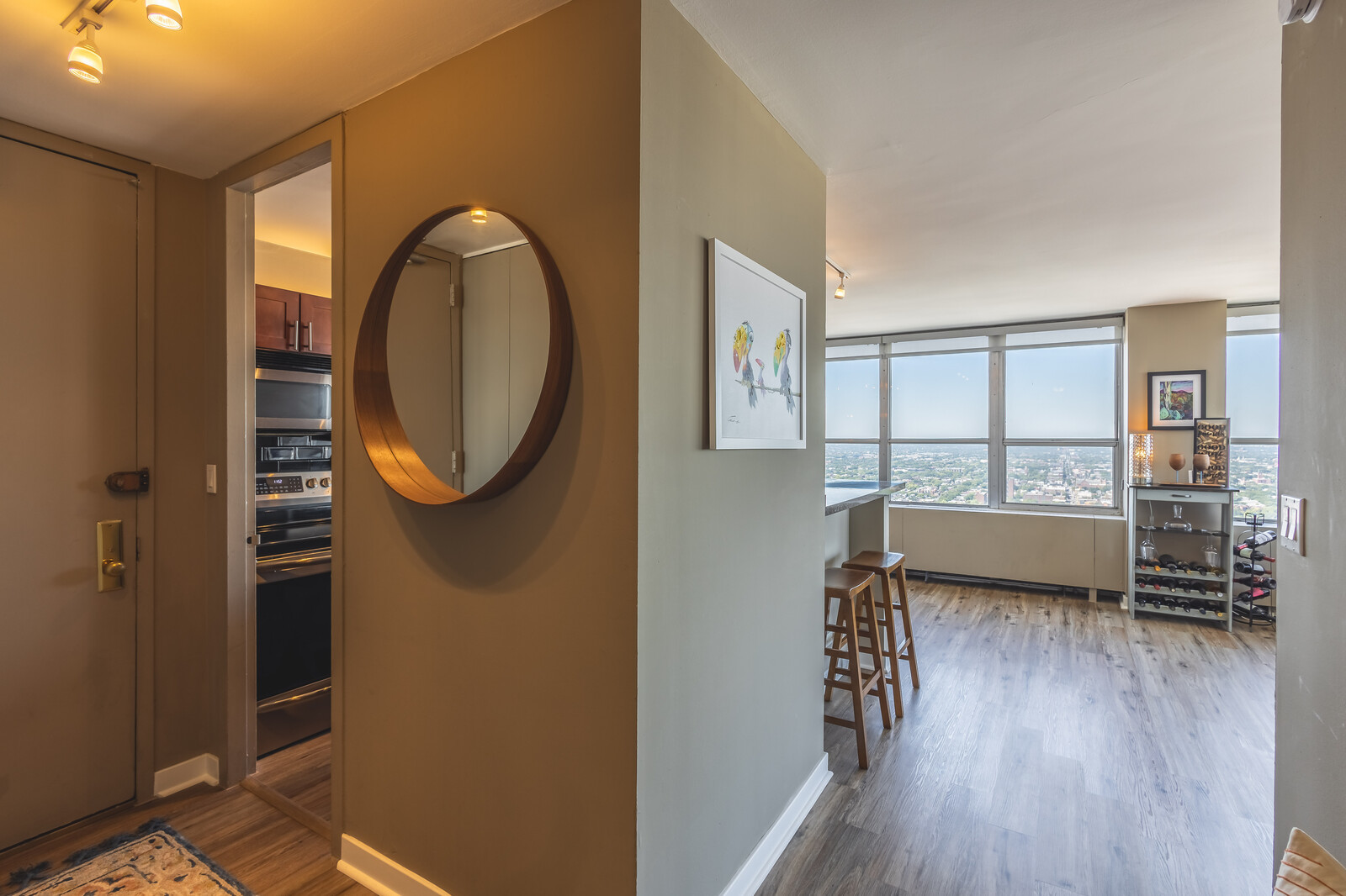 655 West Irving Park Road, Unit 4616 Chicago, IL 60613 - Photo 15 of 25 a view of a livingroom with furniture and wooden floor