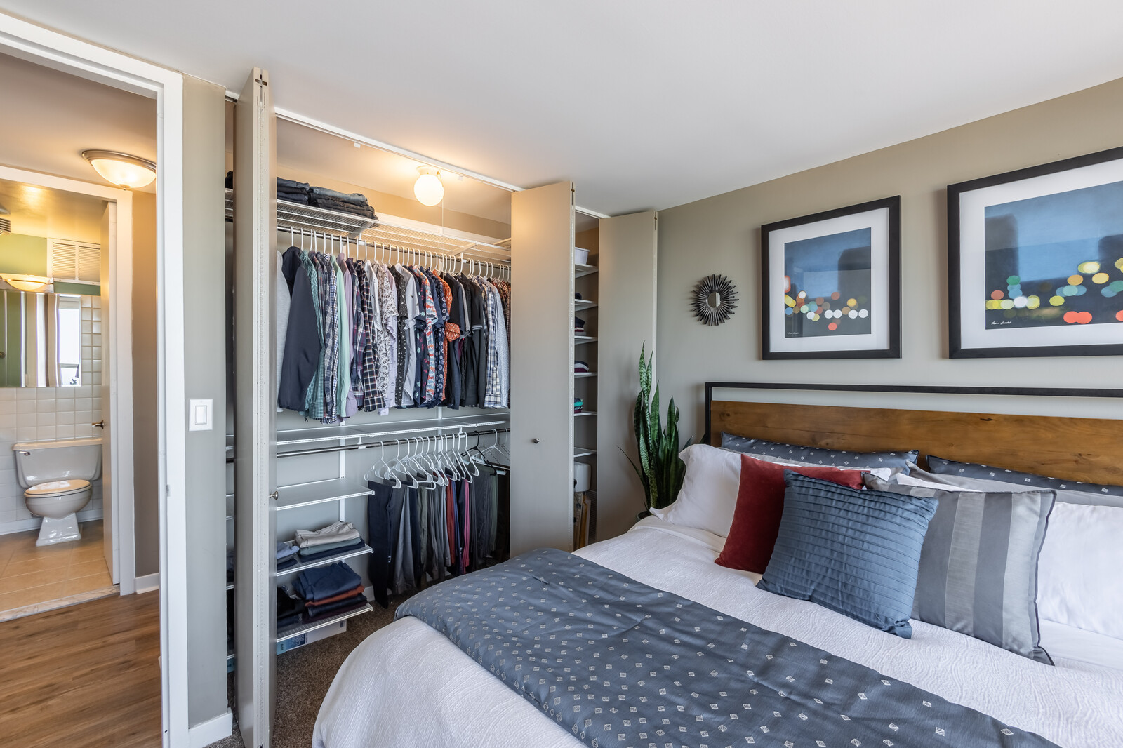 655 West Irving Park Road, Unit 4616 Chicago, IL 60613 - Photo 17 of 25 a bedroom with a bed and a view of bathroom